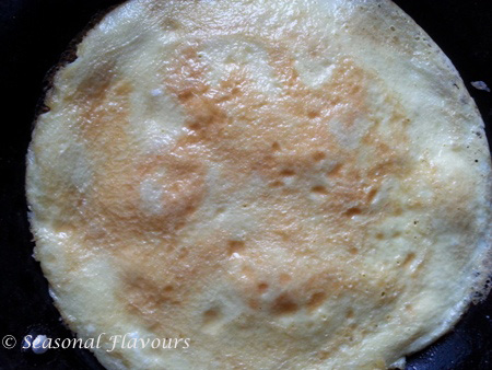 Flip the egg coated paratha over for Calcutta Frankie recipe