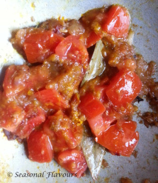 Add chopped tomatoes for Indian fish curry