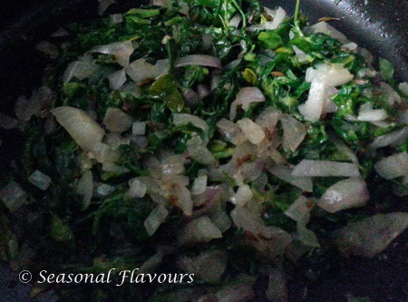 Add methi leaves to fried onions for Methi Mutter Malai