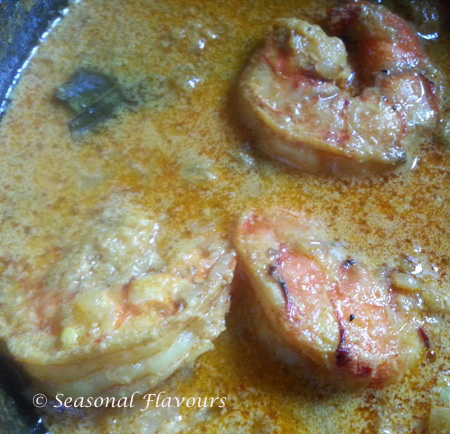 Simmer chingri maach for malaikari till cooked