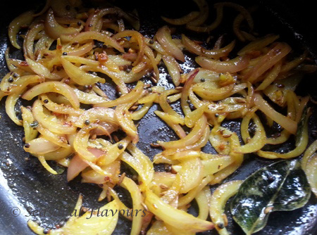 Fry onions for vegetarian dal with tomato