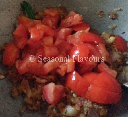 Add tomatoes for Andhra Egg curry masala