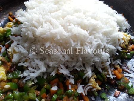 Mix in the rice for homemade stir fry Chinese dish
