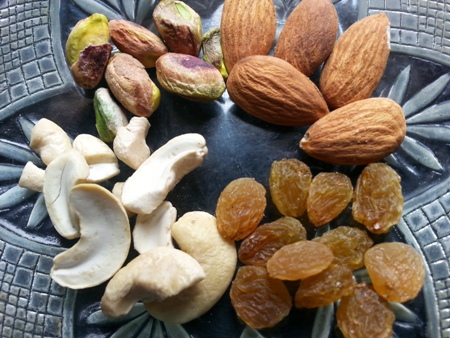 Mix chopped nuts into Bengali Patali Gurer Payesh