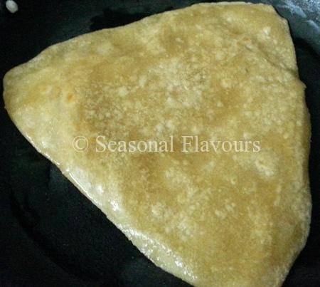 Cook the Indian Flatbread on a tava