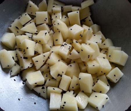 Fry chopped potato for alu khus khus