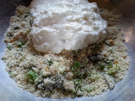 Add curd and salt to suji idli batter