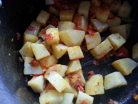 Add cubed potatoes for aloo palak curry