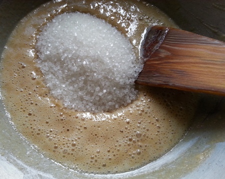 Add sugar to sauteed wheat atta