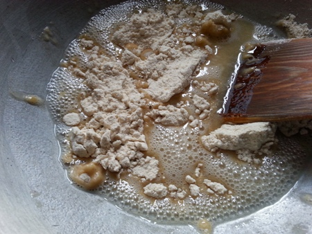 Saute whole wheat flour in ghee.