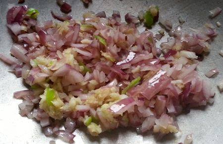 Fry chopped onion. ginger-garlic for vegan brinjal recipe