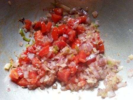 Add chopped tomatoes for brinjal fry