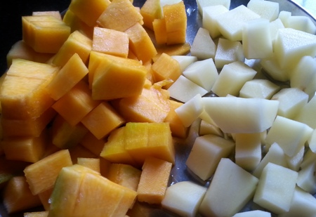Cut pumpkin and potato into cubes for chakka
