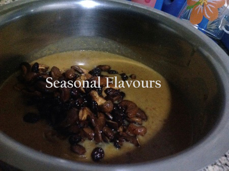 Garnish moong dal payasam with nuts, raisins and coconut slices