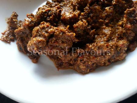 Grind roasted spices with tamarind paste for Kundapur chicken