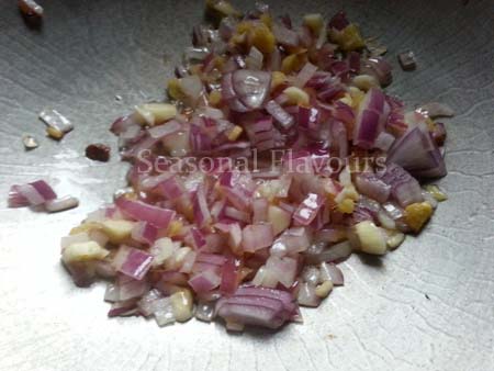 Stir fry chopped onions, ginger and garlic for bean curd recipe