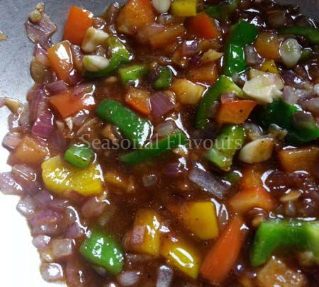 Add spring onions, capsicum cubes and sauces for bean curd recipe
