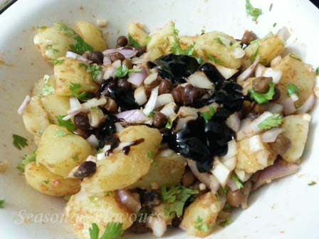 Add tamarind sauce and lime juice to potato and chickpea chaat