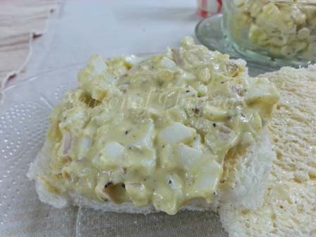Spread egg salad filling on bread