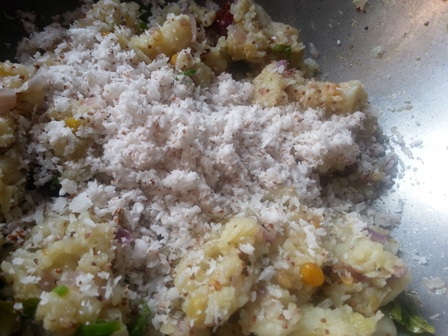 Add grated coconut to plantain fry