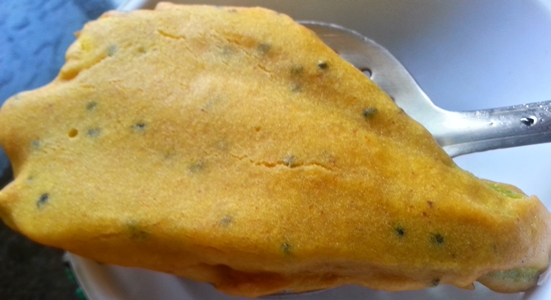 drain fried kumro phool on napkin for Bengali fritters recipe