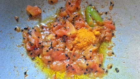 add spices for Shorshe Bhetki curry Indian recipe