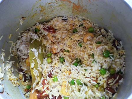 Add soaked rice for yellow pulao recipe