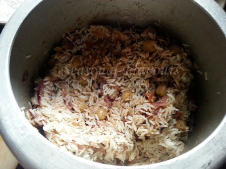 Add rice for Chickpeas Biryani Recipe