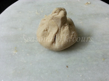 Seal edges of sattu encased dough