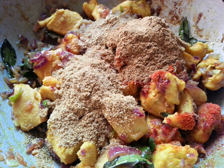 Add spice powders to the chicken curry