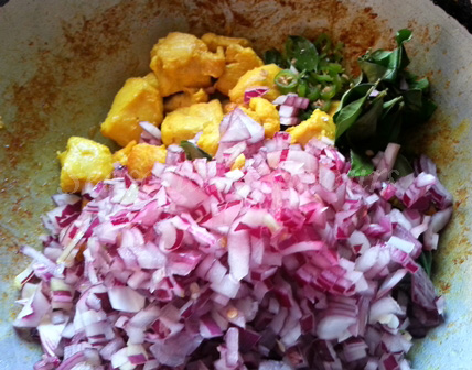Add onons, chillies and curry leaves to chicken