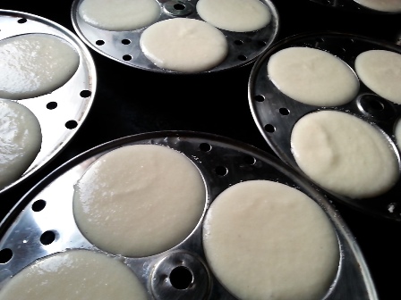 Fill idli moulds with batter