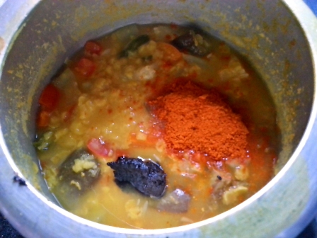 Sambhar powder, tamarind, jaggery and salt added to dal vegetables