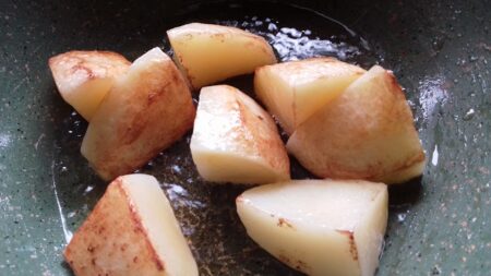 Fry potatoes for dhok'r gravy
