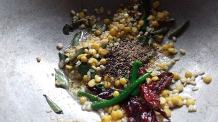 Add mustard and jeera seeds for coconut rice