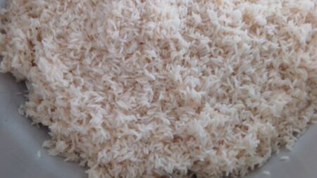 Wash raw rice for Kobbari Annam