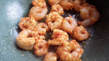 Saute marinated shrimp