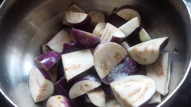 Salt the brinjals for eggplant recipe