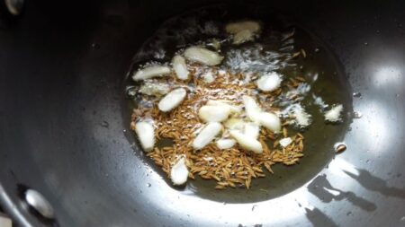 Roast garlic cloves for lehsuni dal tadka