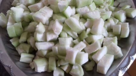 Chop ridge gourd into cubes for curry