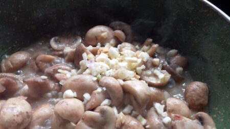 Add garlic to the mushrooms