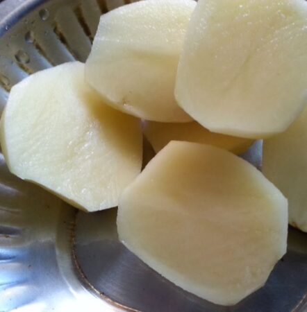 Boil potatoes for Bhuna Chicken