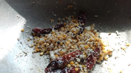 Add grated coconut for Karuveppilai powder