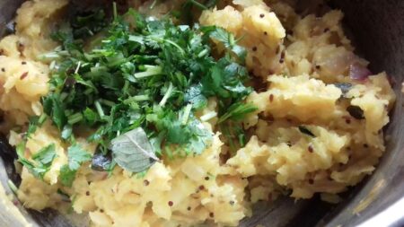 Add coriander leaves to potato masala