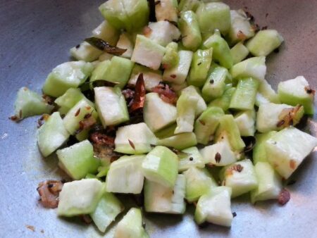 Add ridge gourd pieces to the pan