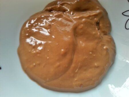 Spread chocolate custard over the biscuits