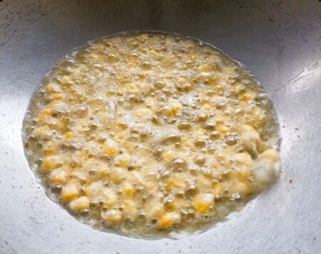 Fry corn over medium heat