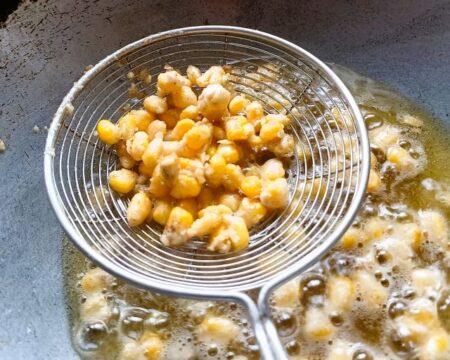 Remove crispy corn kernels with a slotted spoon