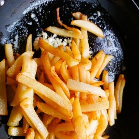 Add fries to butter