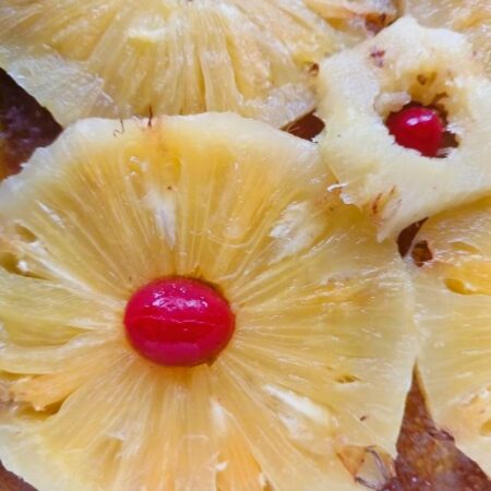 Decorate with cherries for pineapple upside cake using fresh pineapple